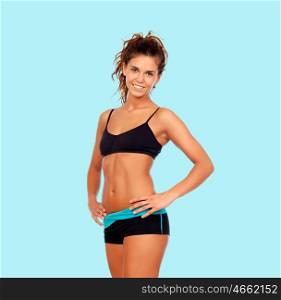 Beautiful woman with fitness clothes on a blue background