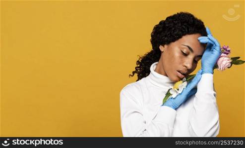 beautiful woman with floral gloves copy space