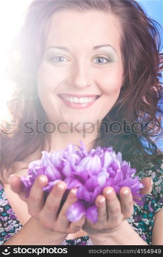 beautiful woman with flower on blue background