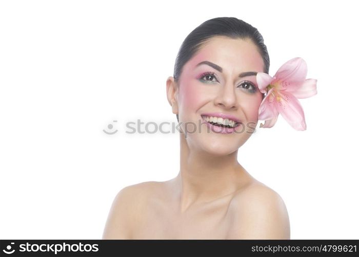 Beautiful woman with flower smiling