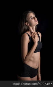 Beautiful woman with healthy body on black background