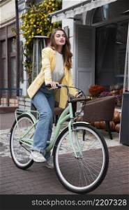 beautiful woman with her bike street