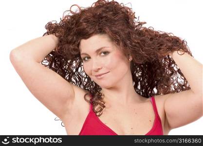 Beautiful woman with her hands in her hair