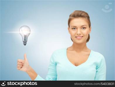 beautiful woman with light bulb showing thumbs up