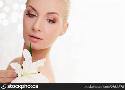 Beautiful woman with lilly flower portrait.