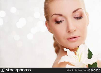 Beautiful woman with lilly flower portrait.