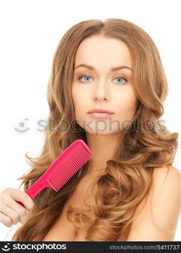 beautiful woman with long curly hair and brush