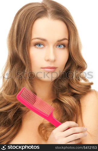 beautiful woman with long curly hair and brush