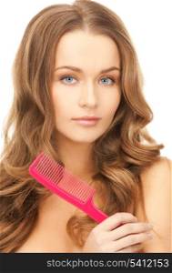 beautiful woman with long curly hair and brush