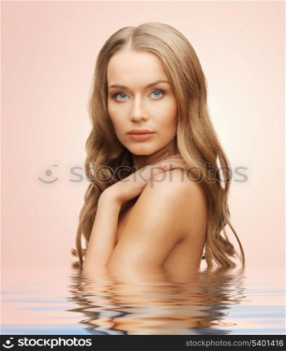beautiful woman with long hair in water