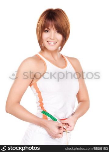 beautiful woman with measure tape over white