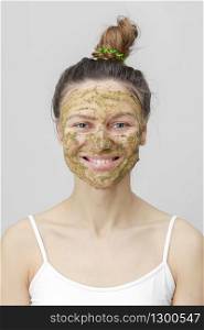 Beautiful woman with natural face mask clean skin rejuvenation isolated on white background.. Beautiful woman with natural face mask clean skin rejuvenation isolated on white background