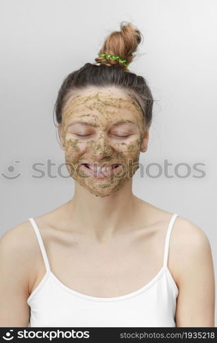 Beautiful woman with natural face mask clean skin rejuvenation isolated on white background. skin care. ecological mask. Beautiful woman with natural face mask clean skin rejuvenation isolated on white background. skin care. ecological mask.