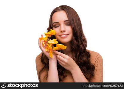 Beautiful woman with orchid flower isolated on white