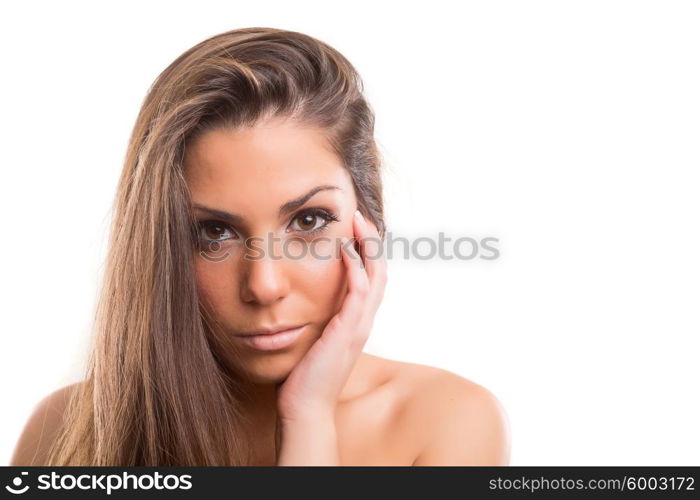 Beautiful woman with perfect skin posing over white