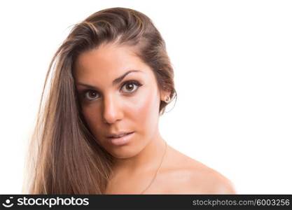 Beautiful woman with perfect skin posing over white