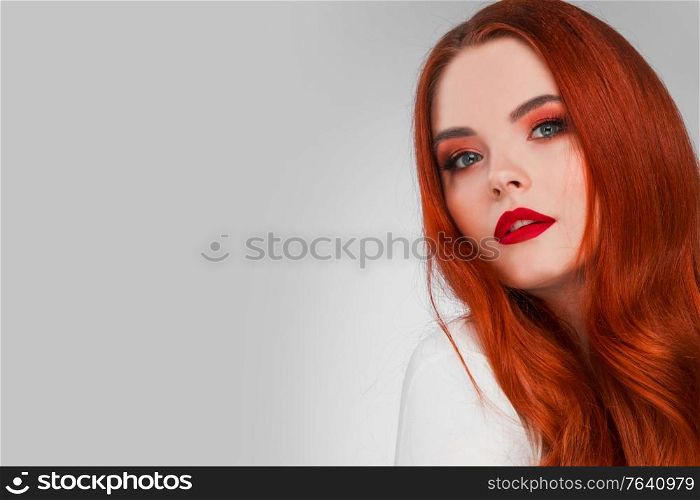 Beautiful Woman with Red Hair and bright makeup. Beautiful Woman with Red Hair