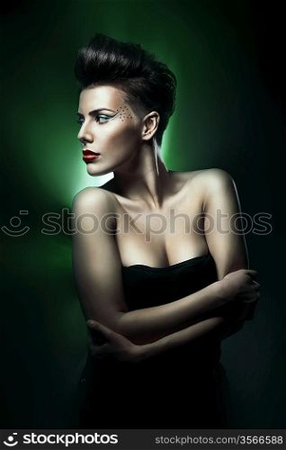beautiful woman with red lips in green light