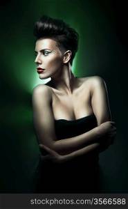 beautiful woman with red lips in green light