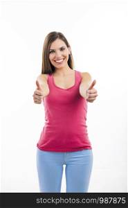 Beautiful woman with thumbs up isolated over a white background