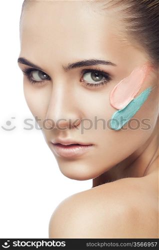 beautiful woman with two paint strokes on face on white background