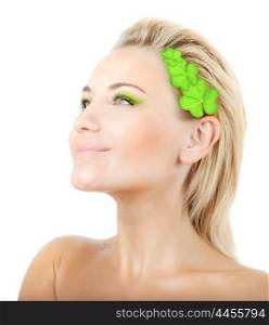 Beautiful woman with wreath of clover, fresh green plant leaves in blond hair, female face portrait isolated over white background, pretty girl with bright makeup, st. Patrick&rsquo;s day, spring holiday