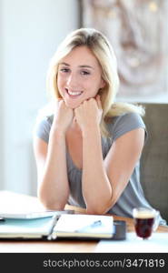 Beautiful woman working at home on agenda