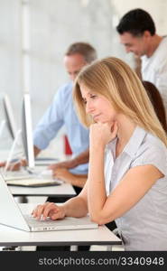 Beautiful woman working in the office on laptop computer