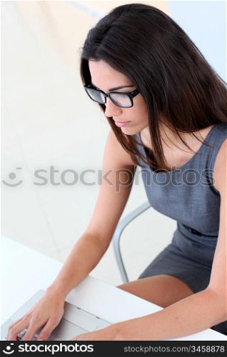 Beautiful woman working on laptop computer