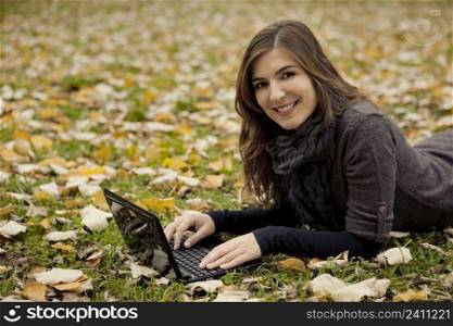 Beautiful woman working with a laptop in outdoor