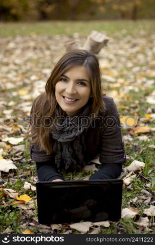 Beautiful woman working with a laptop in outdoor