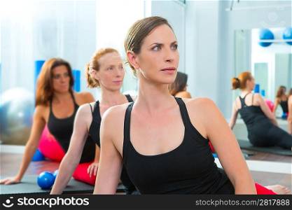 Beautiful women group in a row at aerobics gym class