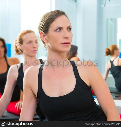 Beautiful women group in a row at aerobics gym class