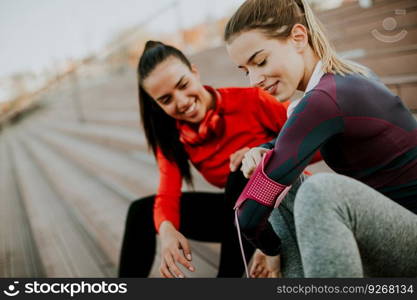 Beautiful women relaxing after a long run in the city  and have fun