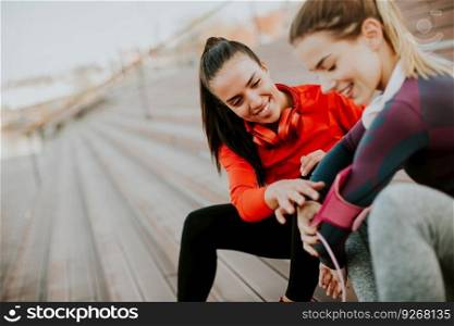 Beautiful women relaxing after a long run in the city  and have fun