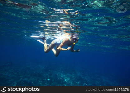 Beautiful women snorkeling in the tropical sea