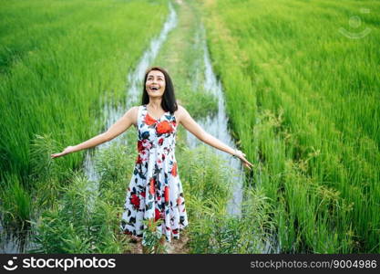 Beautiful women walk happily on the meadow.