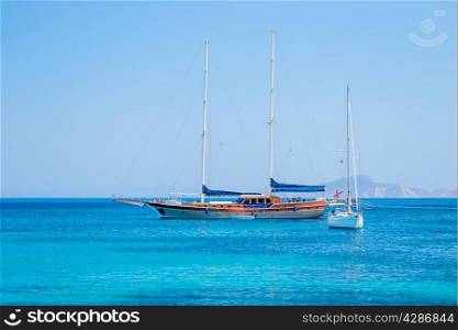 beautiful yachts in the turquoise sea on a background of mountains