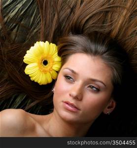 beautiful yellow flowers in girl hair