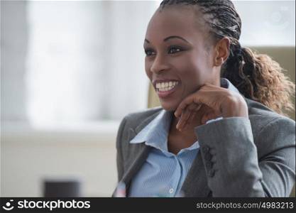 Beautiful young african american businesswoman working on computer at office