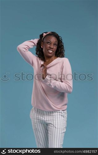Beautiful young african woman on blue background