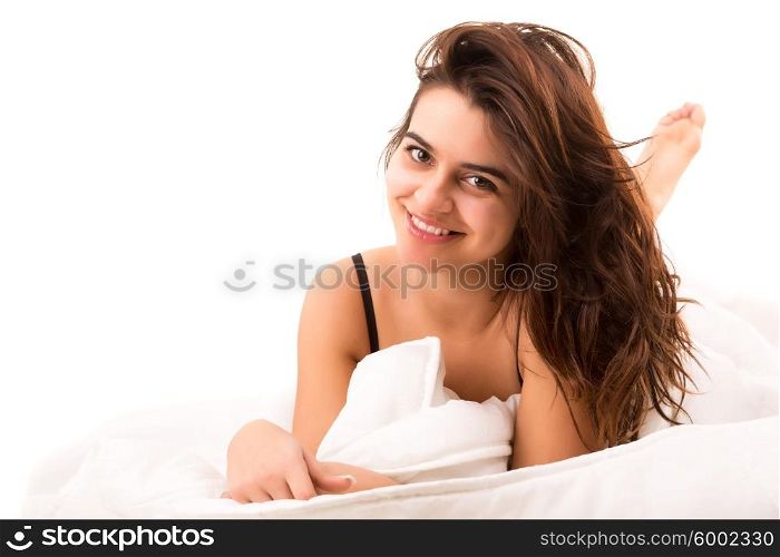 Beautiful young and beautiful woman relaxing in bed