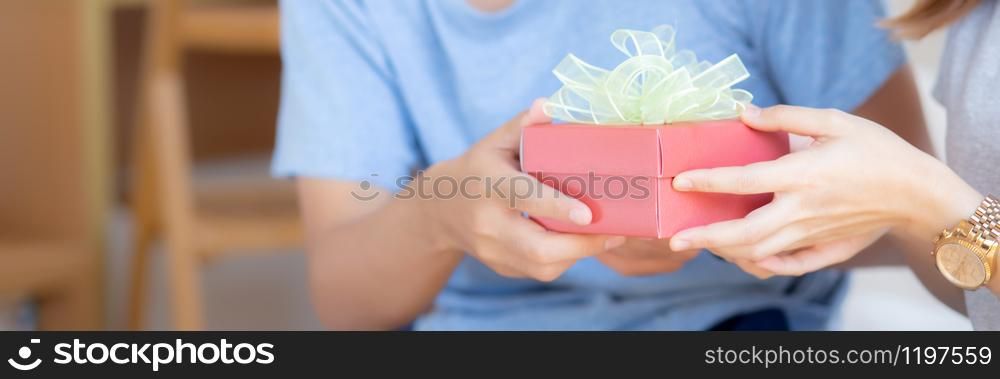 Beautiful young asian couple in love surprise gift box in bedroom at home, family anniversary with romantic together with relationship, Celebrating Valentine Day concept, banner website.