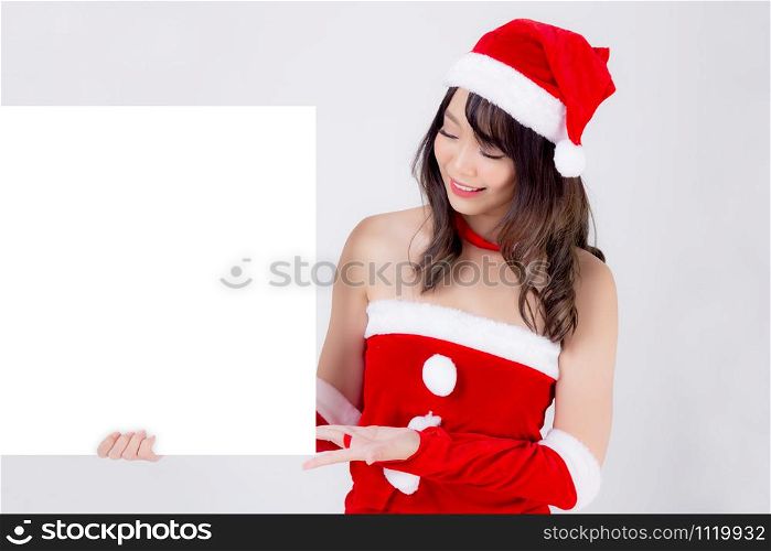 Beautiful young asian Santa woman holding blank board for xmas isolated on white background, beauty model asia girl show empty banner paper poster in Christmas holiday and new year for advertisement.