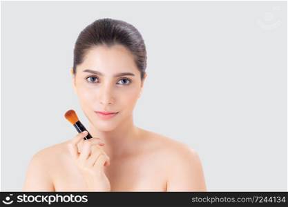 Beautiful young asian woman applying blusher with cheek on face isolated on white background, makeup and cosmetic, girl powder with brush on facial, beauty girl with skincare, elegant and attractive.
