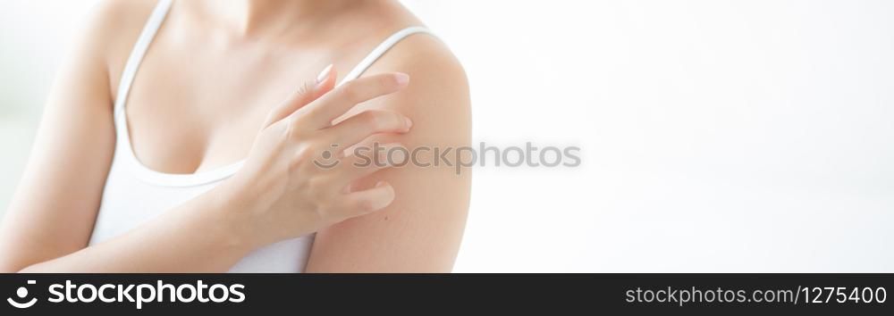 Beautiful young asian woman applying cream and treatment for skin care touch on shoulder, girl with lotion and moisturizing for health body part, lifestyle and beauty cosmetic concept, banner website.