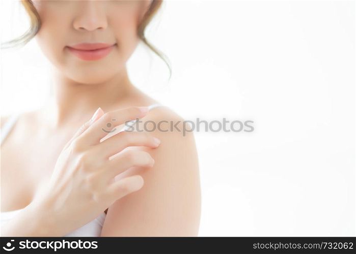 Beautiful young asian woman applying cream and treatment for skin care touch on shoulder, asia girl with lotion spa and moisturizing for health and wellness body part, lifestyle and beauty cosmetic concept.