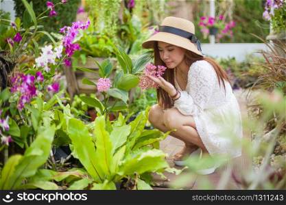 Beautiful young asian woman enjoying the freshness of a lone