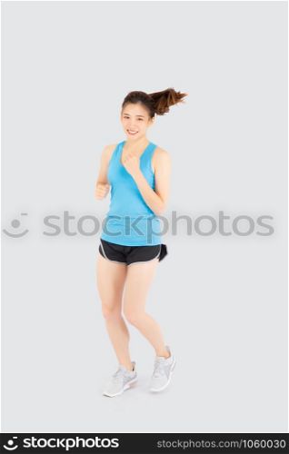 Beautiful young asian woman happy and smiling jogging isolated on white background, asia girl cheerful in sport is activity exercise cardio and workout with running for healthy, health concept.