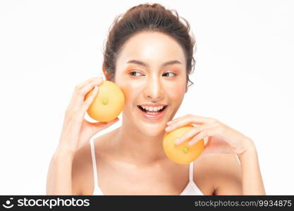 Beautiful Young Asian Woman Holding orange vitamin c smile feeling so happy and cheerful with healthy Clean and Fresh skin,isolated on white background,Beauty Cosmetics spa and treatment Concept